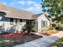 Gray house with landscaping and walkway at 1126 Villa Ln # 91, Apopka, FL 32712