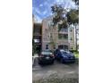 Two-story condo building with parking and landscaping at 3384 Corona Village Way # 108, Orlando, FL 32835