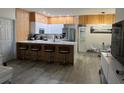 Modern kitchen with stainless steel appliances and island at 3384 Corona Village Way # 108, Orlando, FL 32835