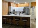Modern kitchen with stainless steel appliances and island at 3384 Corona Village Way # 108, Orlando, FL 32835