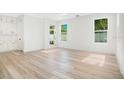 Bright and airy living room with light hardwood floors and plenty of natural light at 131 E Grant, Orlando, FL 32806