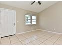 Bright living room with tile floors and a view of the backyard at 810 Kangaroo Ct, Deltona, FL 32738