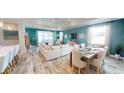 Bright living room with hardwood floors, large windows and an open concept design at 1681 Andover Ridge Dr, Deland, FL 32720