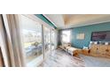 Living area with sliding glass doors opening to a relaxing patio at 1681 Andover Ridge Dr, Deland, FL 32720