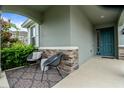 Inviting front porch with seating area at 890 Terrapin Dr, Debary, FL 32713