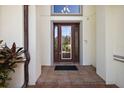 Elegant front entry with a decorative door and tiled flooring at 212 Crestrun Loop, Leesburg, FL 34748