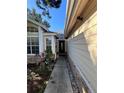 Front entry walkway leading to the front door at 2939 Falling Tree Cir, Orlando, FL 32837