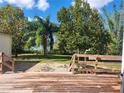 Wooden deck overlooking backyard and lake at 14902 Arrena Rd, Winter Garden, FL 34787