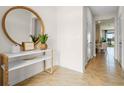 Bright entryway with a large mirror and console table, offering a welcoming atmosphere at 2224 Tongass Bnd, Davenport, FL 33837