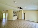 Living room with tile floor and ceiling fan at 765 Farrington Dr, Deltona, FL 32725