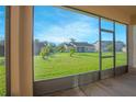 Screened-in porch overlooking backyard and neighboring houses at 3070 Silver Fin Way, Kissimmee, FL 34746
