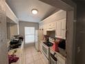 Small kitchen with white cabinets at 301 N Westmoreland Dr, Orlando, FL 32805