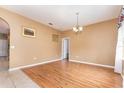 Simple dining room with light brown laminate flooring and neutral walls at 203 W Fiesta Key Loop, Deland, FL 32720