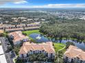 Condo community with lake and fountain at 8298 Portofino Dr # 202, Davenport, FL 33896