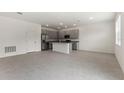 Modern kitchen with gray cabinets and island at 188 Bottle Brush, Haines City, FL 33844