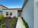Well-maintained house exterior with a landscaped walkway and front yard at 1393 Asher Mason Ave, Kissimmee, FL 34744