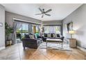 Spacious living room with grey couches, large windows and water views at 8815 Worldquest Blvd # 103 In Building 3, Orlando, FL 32821
