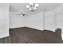 Open living area with dark hardwood floors and neutral walls at 132 Vista Verdi Cir # 220, Lake Mary, FL 32746