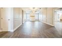 Large main bedroom with ceiling fan and hardwood floors at 93 Bryan Cave Rd, South Daytona, FL 32119