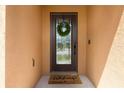 Inviting front door with a wreath and welcome mat at 2717 Eagle Cliff Dr, Kissimmee, FL 34746