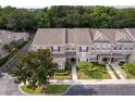 Aerial view of townhomes and landscaping at 2295 Park Maitland Ct, Maitland, FL 32751