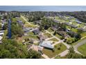 Aerial view of homes near a lake at 12009 Eagle Point Ct, Leesburg, FL 34788