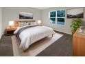 Main bedroom with a queen bed and neutral decor at 309 Gina Ln, Davenport, FL 33837