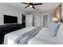 Bright bedroom with TV and private bathroom access at 1406 Moon Valley Dr, Davenport, FL 33896