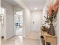 Light and airy entryway with view to the playroom at 1220 Sugarwood St, Davenport, FL 33837