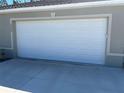 View of the home's attached two-car garage at 3402 Sw 165Th Loop, Ocala, FL 34473