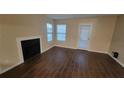 Bright living room with fireplace and patio access at 5600 Devonbriar Way # N202, Orlando, FL 32822