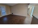 Spacious living room with tile floors and fireplace at 5600 Devonbriar Way # N202, Orlando, FL 32822