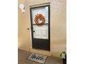 Inviting condo entry with decorative wreath and welcoming mat at 458 Windmeadows St, Altamonte Springs, FL 32701