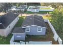 Aerial view of a charming house with a backyard and surrounding houses at 653 W Thomas St, Lakeland, FL 33805
