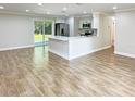 Remodeled kitchen features stainless steel appliances and an island at 511 W Gardenia Dr, Orange City, FL 32763