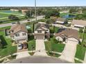 Three houses with solar panels, one with a pool, in a cul-de-sac at 1909 Cayman Cove Cir, St Cloud, FL 34772