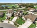 Three houses with solar panels, one with a pool, in a cul-de-sac at 1909 Cayman Cove Cir, St Cloud, FL 34772