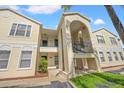 Condo building with multiple units and parking spaces in front at 8850 Grand Palms Circle # B, Kissimmee, FL 34747