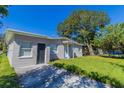 Updated bungalow with a large front yard and driveway at 1300 Mercy Dr, Orlando, FL 32808