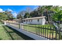 Newly renovated home with picket fence and well-manicured lawn at 1502 Ne 22Nd St, Ocala, FL 34470