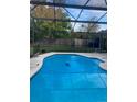 Relaxing screened-in pool with a large backyard at 2618 Coventry Ln, Ocoee, FL 34761