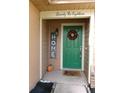 Inviting front door with wreath and seasonal decor at 2618 Coventry Ln, Ocoee, FL 34761