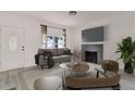 Living room with fireplace and modern furniture at 500 N 13Th St, Leesburg, FL 34748