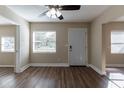 Bright living room with hardwood floors and neutral walls at 1300 Mercy Dr, Orlando, FL 32808