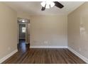 Spacious bedroom with hardwood floors and ceiling fan at 1300 Mercy Dr, Orlando, FL 32808