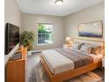 Comfortable bedroom with large window and modern decor at 1048 Universal Rest Pl, Kissimmee, FL 34744