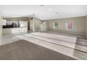 Open concept living area with new flooring at 1048 Universal Rest Pl, Kissimmee, FL 34744