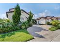 Luxury home with manicured landscaping and driveway at 15716 Panther Lake Dr, Winter Garden, FL 34787