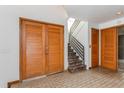 Bright entryway with double doors and staircase at 1000 Winderley Pl # 7, Maitland, FL 32751