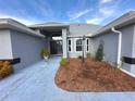 Front entrance with landscaping and walkway at 15701 Sw 37Th Cir, Ocala, FL 34473